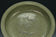 A LARGE YUAN DYNASTY LONGQUAN CELADON DRAGON DISH