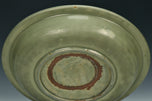 A LARGE YUAN DYNASTY LONGQUAN CELADON DRAGON DISH