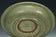 A LARGE YUAN DYNASTY LONGQUAN CELADON DRAGON DISH