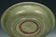 A LARGE YUAN DYNASTY LONGQUAN CELADON DRAGON DISH