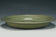 A LARGE YUAN DYNASTY LONGQUAN CELADON DRAGON DISH