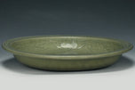 A LARGE YUAN DYNASTY LONGQUAN CELADON DRAGON DISH