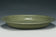 A LARGE YUAN DYNASTY LONGQUAN CELADON DRAGON DISH