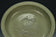 A LARGE YUAN DYNASTY LONGQUAN CELADON DRAGON DISH
