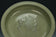 A LARGE YUAN DYNASTY LONGQUAN CELADON DRAGON DISH