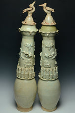 A PAIR OF SONG DYNASTY QINGBAI FUNERARY VASES AND COVERS