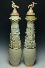 A PAIR OF SONG DYNASTY QINGBAI FUNERARY VASES AND COVERS