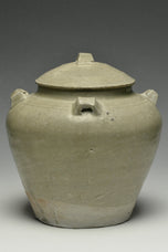 A JIN DYNASTY CELADON GLAZED JAR AND COVER