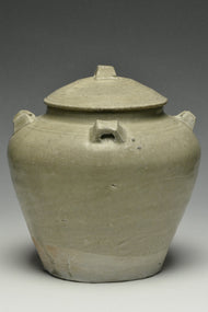 A JIN DYNASTY CELADON GLAZED JAR AND COVER
