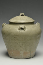 A JIN DYNASTY CELADON GLAZED JAR AND COVER