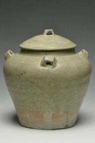 A JIN DYNASTY CELADON GLAZED JAR AND COVER