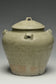 A JIN DYNASTY CELADON GLAZED JAR AND COVER