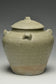 A JIN DYNASTY CELADON GLAZED JAR AND COVER