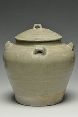 A JIN DYNASTY CELADON GLAZED JAR AND COVER