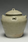 A JIN DYNASTY CELADON GLAZED JAR AND COVER