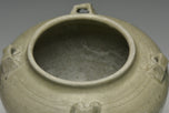 A JIN DYNASTY CELADON GLAZED JAR AND COVER