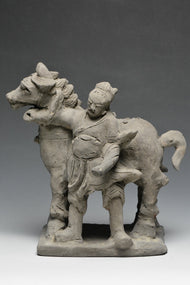 A YUAN DYNASTY POTTERY HORSE WITH GROOM