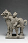 A YUAN DYNASTY POTTERY HORSE WITH GROOM