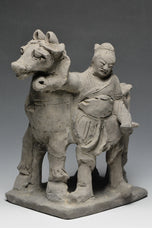 A YUAN DYNASTY POTTERY HORSE WITH GROOM