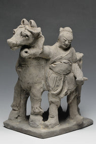 A YUAN DYNASTY POTTERY HORSE WITH GROOM