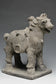 A YUAN DYNASTY POTTERY HORSE WITH GROOM