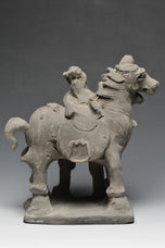 A YUAN DYNASTY POTTERY HORSE WITH GROOM