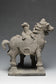 A YUAN DYNASTY POTTERY HORSE WITH GROOM