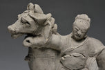 A YUAN DYNASTY POTTERY HORSE WITH GROOM