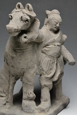 A YUAN DYNASTY POTTERY HORSE WITH GROOM
