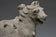 A YUAN DYNASTY POTTERY HORSE WITH GROOM