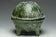 A HAN DYNASTY GREEN GLAZED DING AND COVER