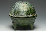 A HAN DYNASTY GREEN GLAZED DING AND COVER