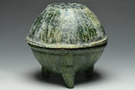 A HAN DYNASTY GREEN GLAZED DING AND COVER