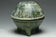 A HAN DYNASTY GREEN GLAZED DING AND COVER