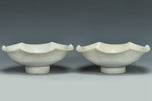 A PAIR OF SONG DYNASTY CARVED QINGBAI FOLIATE-RIM DISHES