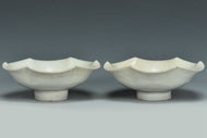 A PAIR OF SONG DYNASTY CARVED QINGBAI FOLIATE-RIM DISHES