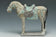 A MING DYNASTY PAINTED POTTERY HORSE