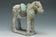 A MING DYNASTY PAINTED POTTERY HORSE