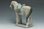 A MING DYNASTY PAINTED POTTERY HORSE