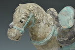 A MING DYNASTY PAINTED POTTERY HORSE