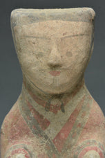 A HAN DYNASTY PAINTED POTTERY KNEELING ATTENDANT