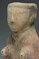 A HAN DYNASTY PAINTED POTTERY KNEELING ATTENDANT