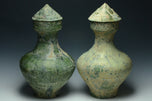 TWO LARGE HAN DYNASTY GREEN GLAZED HU VASES AND COVERS