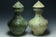 TWO LARGE HAN DYNASTY GREEN GLAZED HU VASES AND COVERS