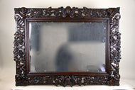 20TH CENTURY, AUSTRIA, BLACK FOREST WALL MIRROR, HAND CARVED, 1919