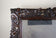 20TH CENTURY, AUSTRIA, BLACK FOREST WALL MIRROR, HAND CARVED, 1919