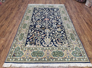 1950S SEMI ANTIQUE PERSIAN QUM TREE OF LIFE RUG, HAND-KNOTTED, WOOL, MIDNIGHT BLUE AND TAN, ANIMAL PICTORIALS, WRITTEN POEM IN BORDERS, 4' 8" X 7' 8"