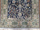 1950S SEMI ANTIQUE PERSIAN QUM TREE OF LIFE RUG, HAND-KNOTTED, WOOL, MIDNIGHT BLUE AND TAN, ANIMAL PICTORIALS, WRITTEN POEM IN BORDERS, 4' 8" X 7' 8"