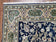 1950S SEMI ANTIQUE PERSIAN QUM TREE OF LIFE RUG, HAND-KNOTTED, WOOL, MIDNIGHT BLUE AND TAN, ANIMAL PICTORIALS, WRITTEN POEM IN BORDERS, 4' 8" X 7' 8"