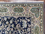1950S SEMI ANTIQUE PERSIAN QUM TREE OF LIFE RUG, HAND-KNOTTED, WOOL, MIDNIGHT BLUE AND TAN, ANIMAL PICTORIALS, WRITTEN POEM IN BORDERS, 4' 8" X 7' 8"
